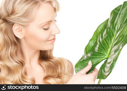 picture of woman with green leaf over white