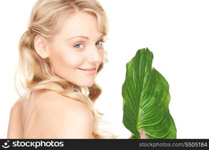 picture of woman with green leaf over white