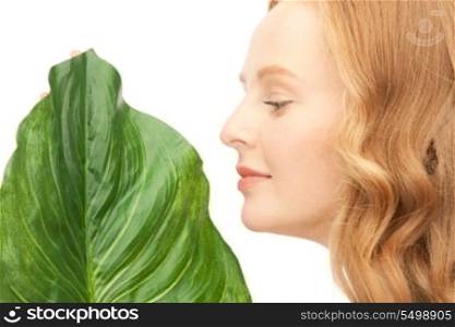 picture of woman with green leaf over white&#xA;