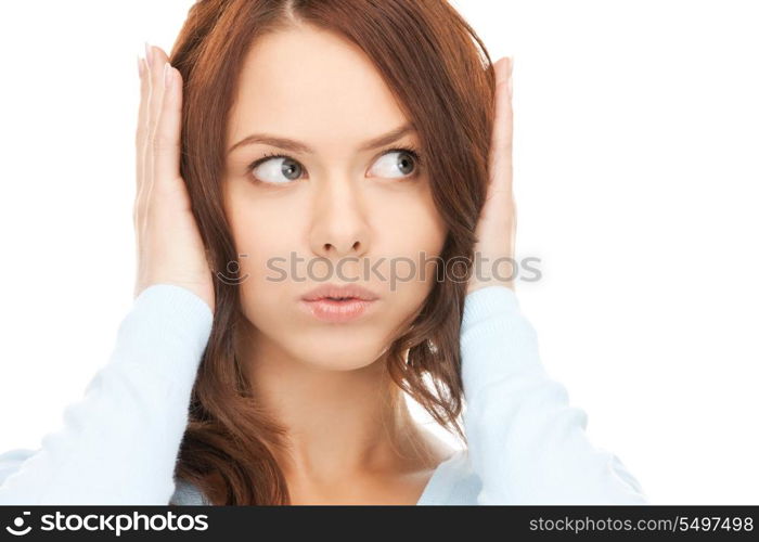 picture of woman with hands on ears