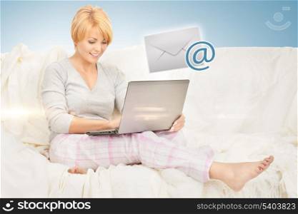 picture of woman with laptop computer sending e-mail