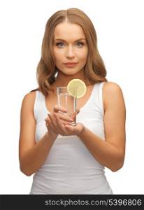 picture of woman with lemon slice on glass of water