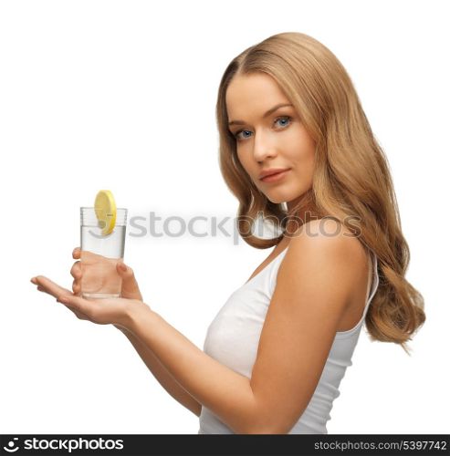 picture of woman with lemon slice on glass of water .
