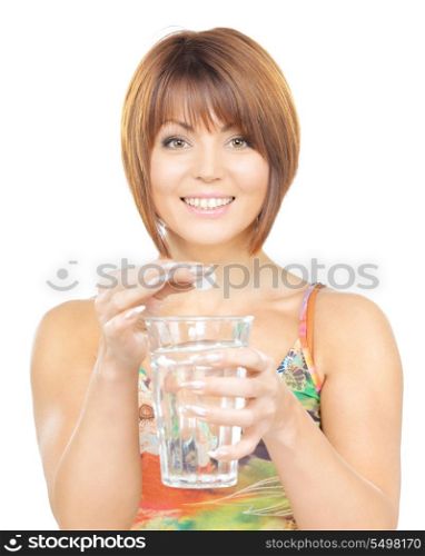 picture of woman with pill and glass of water