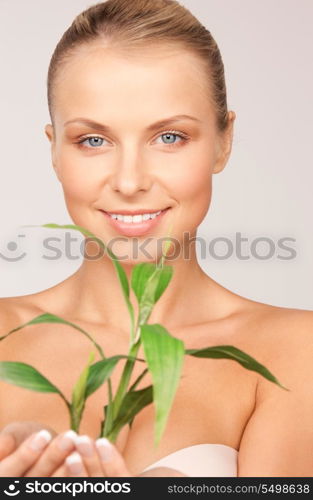 picture of woman with sprout over grey