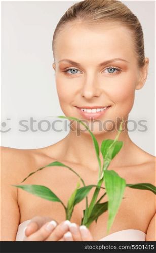 picture of woman with sprout over grey