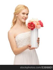 picture of young and beautiful woman with vase of flowers