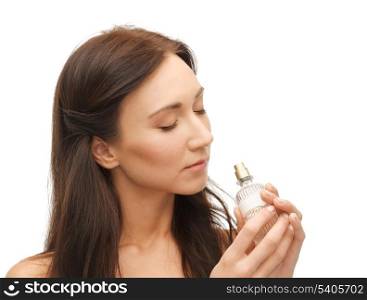 picture of young beautiful woman smelling perfume