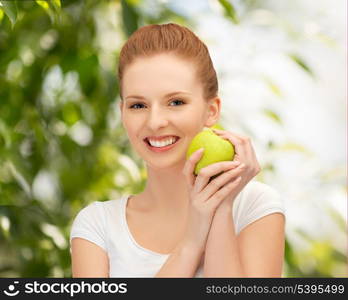 picture of young beautiful woman with green apple