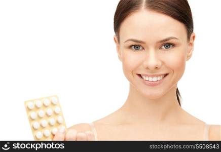 picture of young beautiful woman with pills