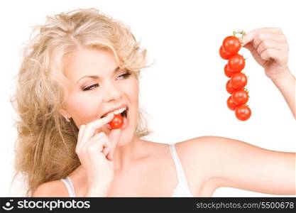 picture of young beautiful woman with ripe tomatoes