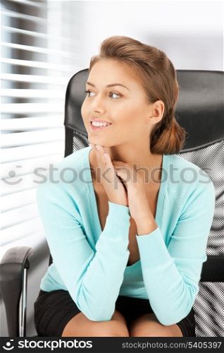 picture of young businesswoman sitting in chair
