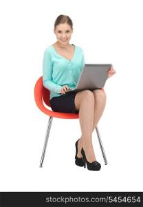 picture of young businesswoman sitting in chair with laptop