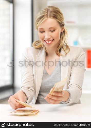 picture of young businesswoman with euro cash money