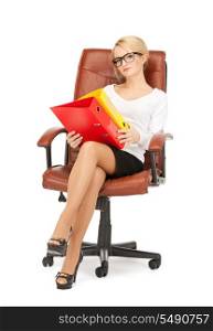 picture of young businesswoman with folders sitting in chair