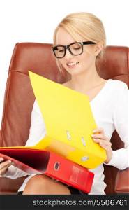 picture of young businesswoman with folders sitting in chair&#x9; &#xA;
