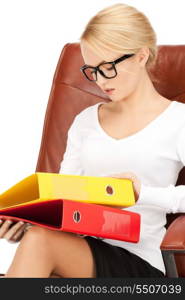 picture of young businesswoman with folders sitting in chair &#xA;