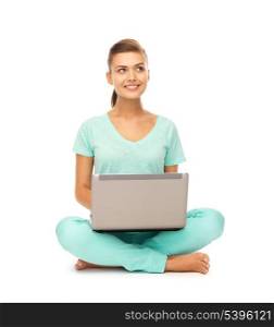 picture of young girl sitting on the floor with laptop