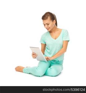 picture of young girl sitting on the floor with tablet pc