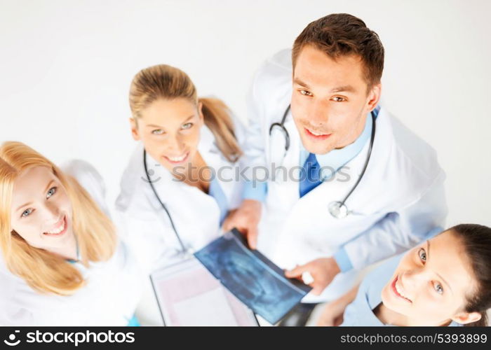 picture of young group of doctors looking at x-ray