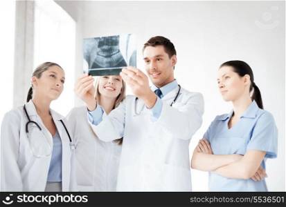 picture of young group of doctors looking at x-ray