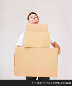 picture of young man carrying carton boxes