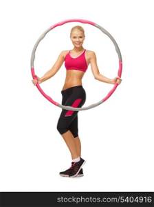 picture of young sporty woman with hula hoop