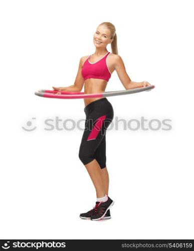 picture of young sporty woman with hula hoop
