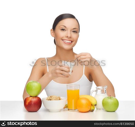 picture of young woman eating healthy breakfast. young woman eating healthy breakfast