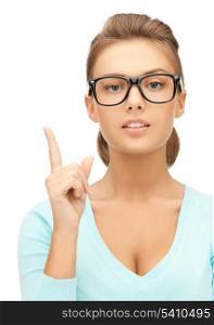 picture of young woman in glasses with finger up..