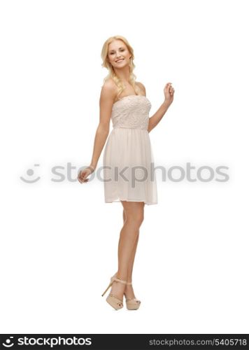 picture of young woman in white dress on high heels.