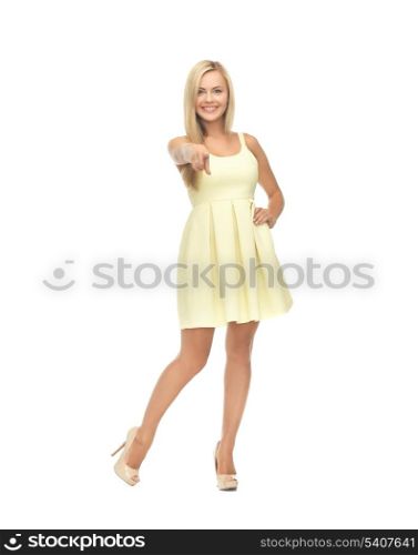 picture of young woman in yellow dress on high heels