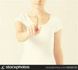 picture of young woman showing finger up..