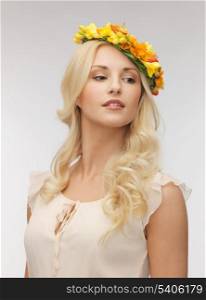 picture of young woman wearing wreath of flowers .