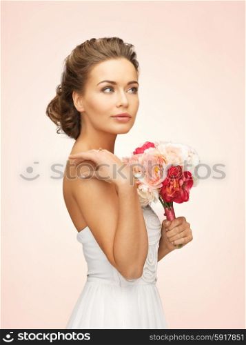 picture of young woman with bouquet of flowers. woman with bouquet of flowers