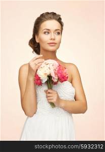picture of young woman with bouquet of flowers. woman with bouquet of flowers