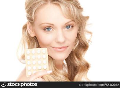 picture of young woman with pills over white