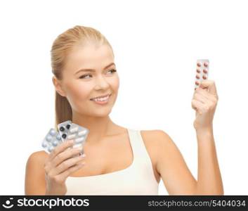picture of young woman with variety of pills