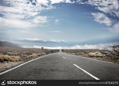 Picture presentic rural landscape with an empty route in the middle
