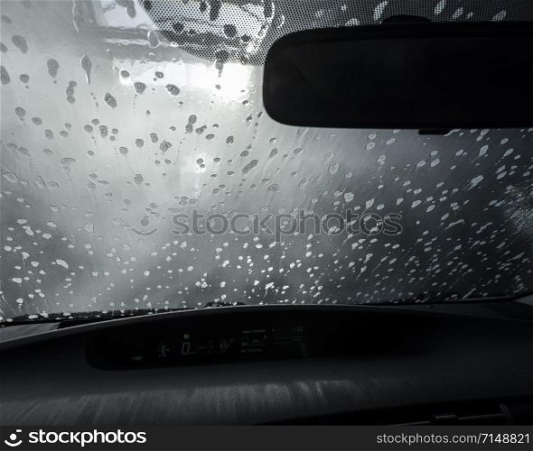 picture taken from car through windshield in car wash