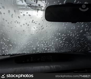 picture taken from car through windshield in car wash