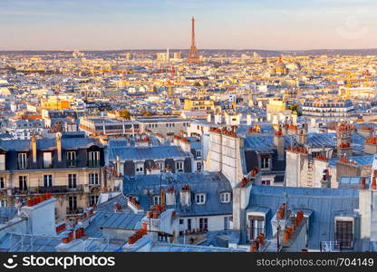 Picturesque aerial view of the city and the roofs in the early morning. Paris, France.. Paris. Scenic aerial view of the city in the early morning.