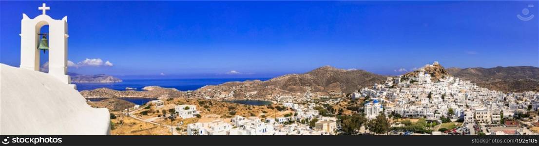 Picturesque authentic Ios island. View of scenic old town Chora with whitewashed houses and churches