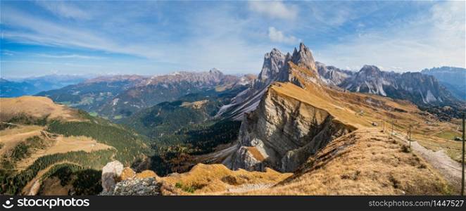 Picturesque autumn Alps mountain scene, famous italian Dolomites Seceda majestic rock, Sass Rigais, Sudtirol, Italy. Beautiful traveling, seasonal and nature beauty concept scene.