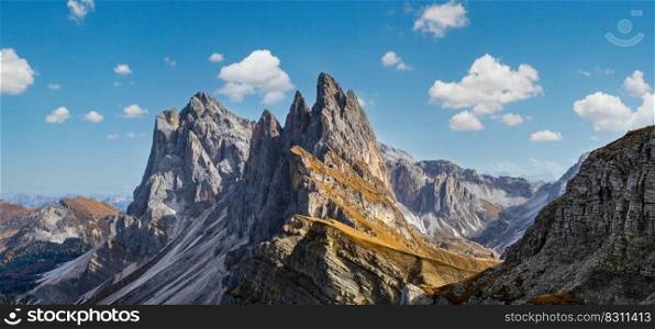 Picturesque autumn Alps mountain scene, famous italian Dolomites Seceda majestic rock, Sass Rigais, Sudtirol, Italy. Beautiful traveling, seasonal and nature beauty concept scene.