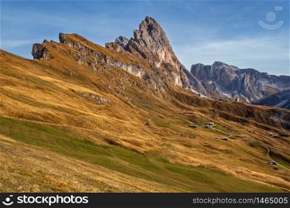 Picturesque autumn Alps mountain scene, famous italian Dolomites Seceda rock, Sass Rigais, Sudtirol, Italy. Beautiful traveling, seasonal and nature beauty concept scene.