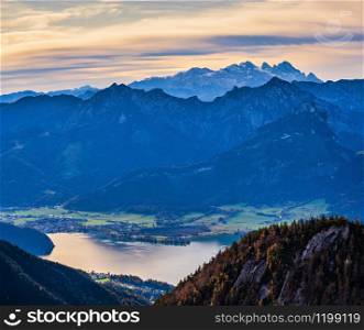 Picturesque autumn morning Alps mountain Wolfgangsee lake view from Schafberg viewpoint, Salzkammergut, Upper Austria. Beautiful travel, hiking, seasonal, and nature beauty concept scene.