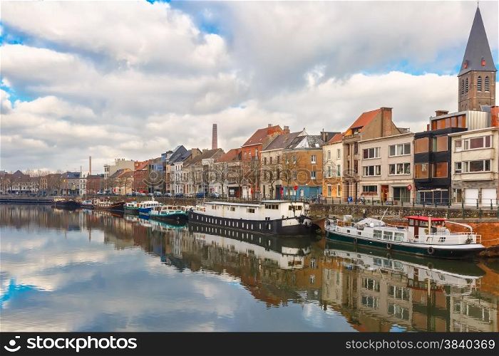 Picturesque embankment of the river Leie with reflections in Ghent town, Belgium