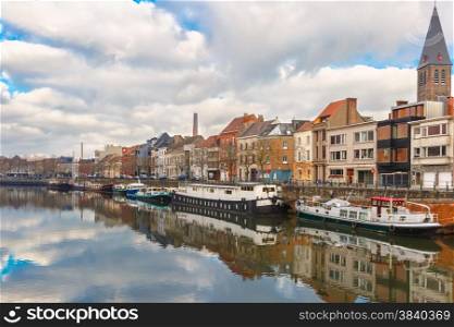 Picturesque embankment of the river Leie with reflections in Ghent town, Belgium