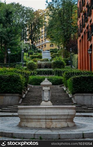 Picturesque fountain and stairs in Madrid, Spain.. Picturesque fountain and stairs in Madrid, Spain